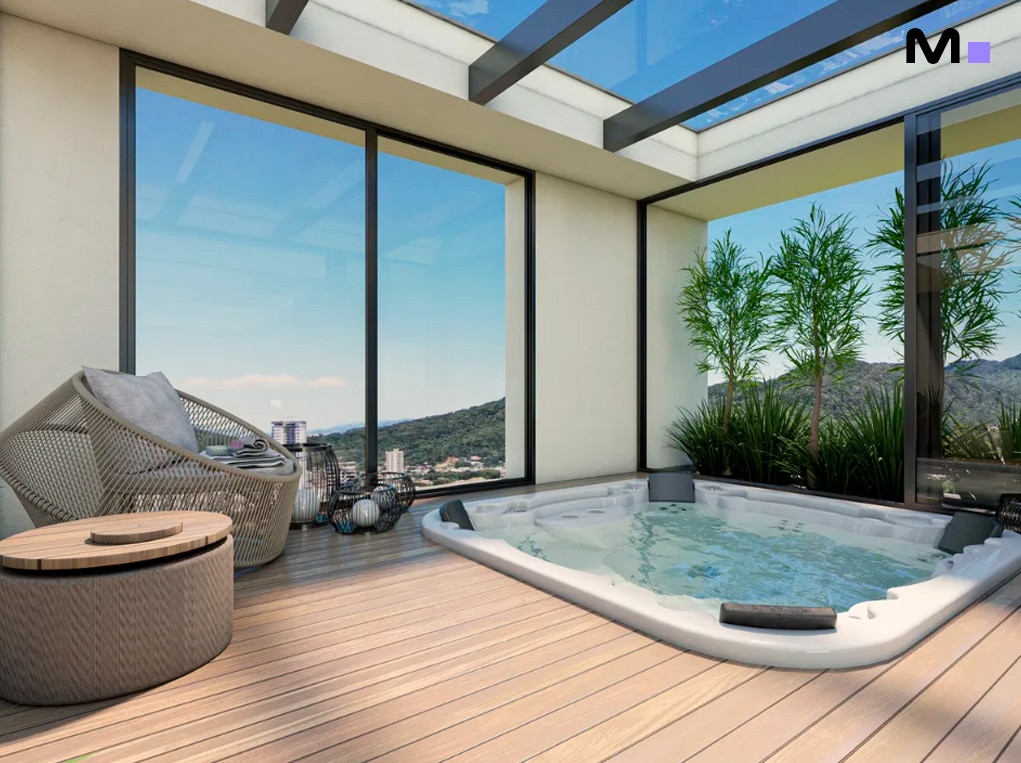 Jacuzzi em área externa envidraçada da Vale Jardon Residence, com vista para montanhas e área de descanso.