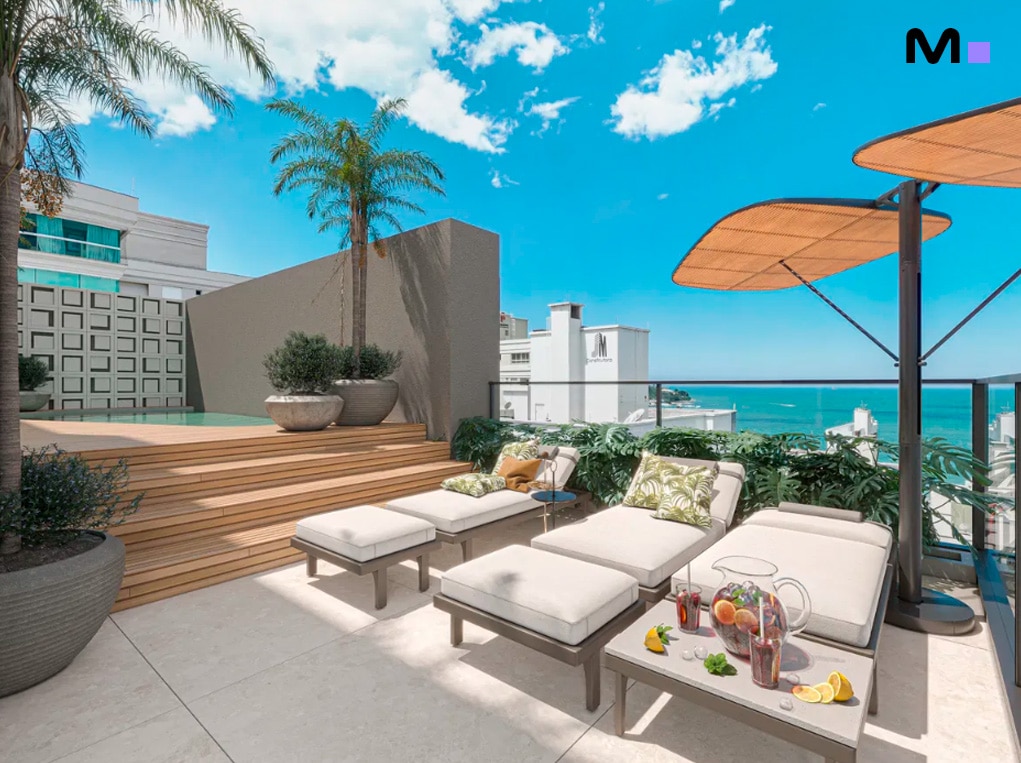 Terraço luxuoso com piscina e espreguiçadeiras no Redentor Residencial, com vista para o mar.