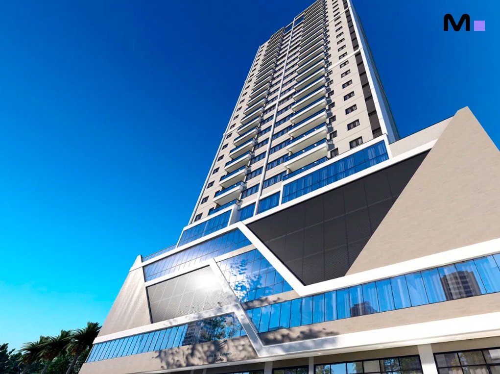 Edifício moderno com design triangular e muitos andares sob céu azul.