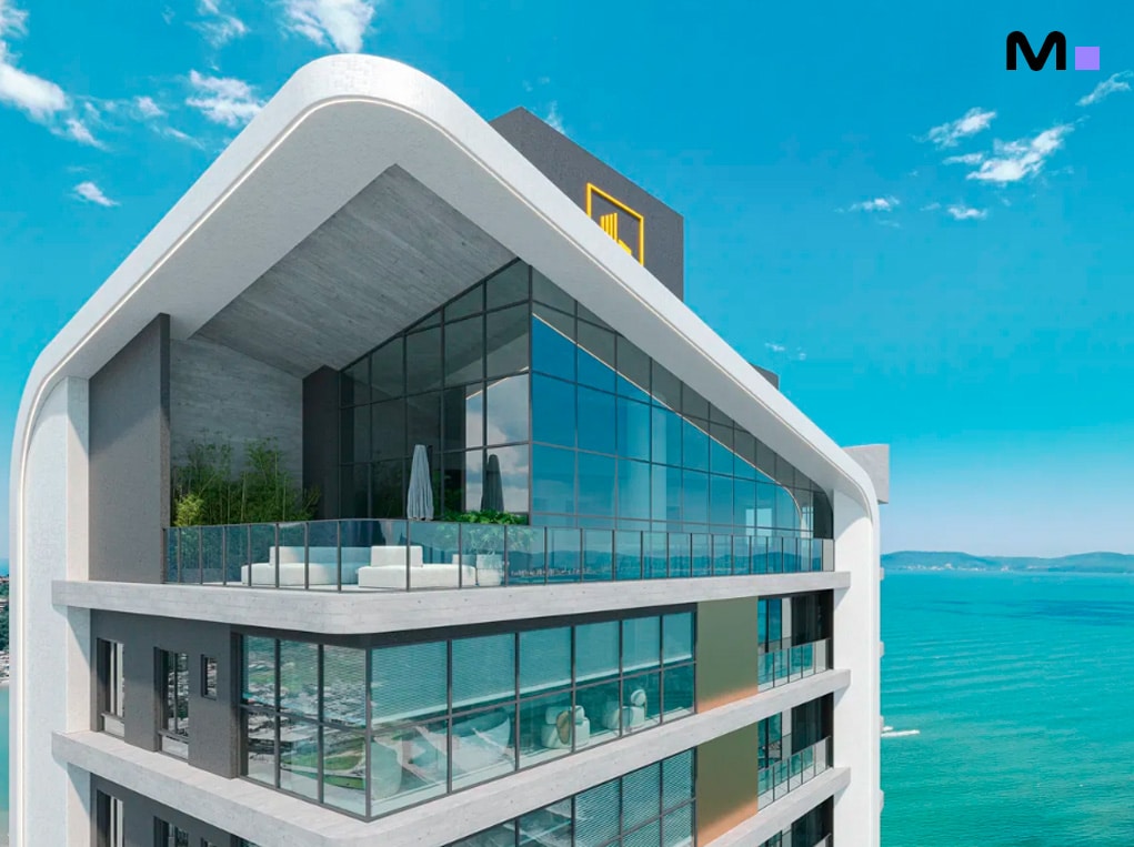 Fachada moderna do Redentor Residencial com vista para o mar.