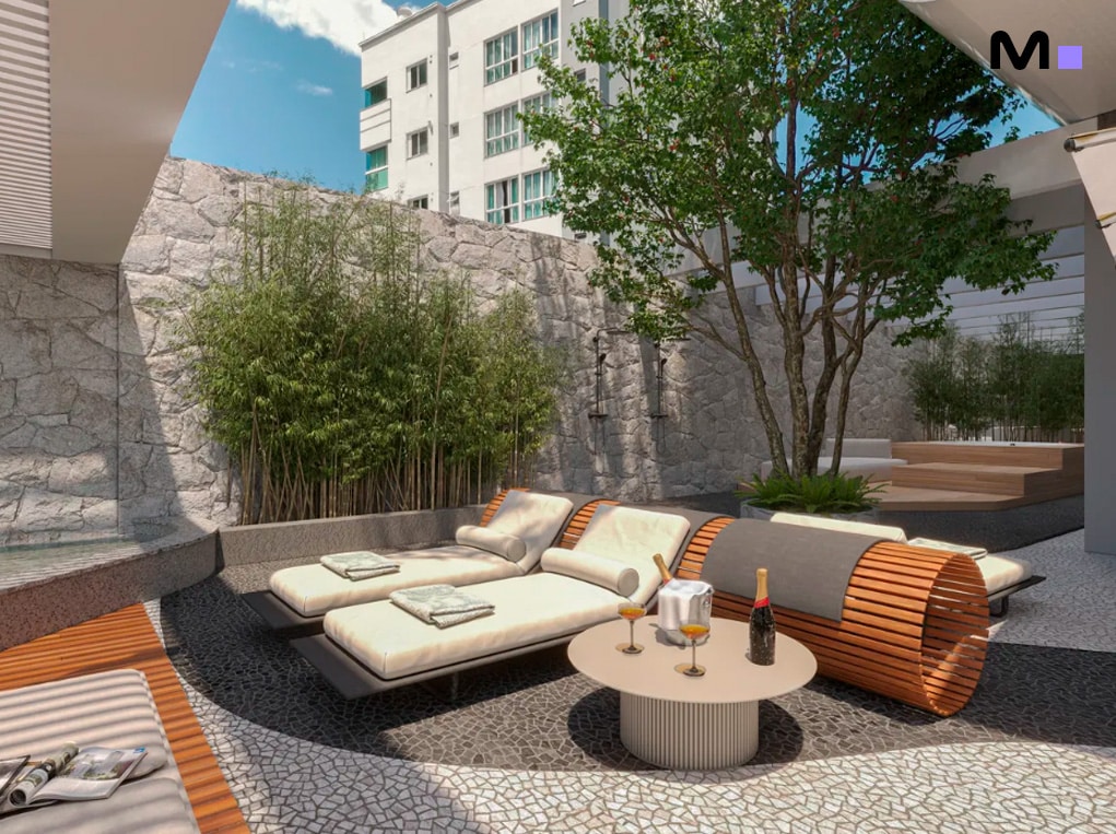 Área de lazer do Redentor Residencial com espreguiçadeiras, mesa com champanhe e paisagismo exuberante.