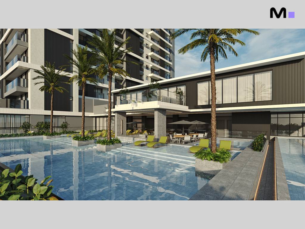 Piscina do Habitat Praia Brava com espreguiçadeiras e palmeiras.