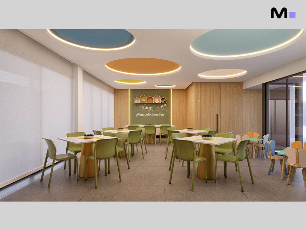 Sala de festas infantil decorada com mesas e cadeiras coloridas. Feliz Aniversário!