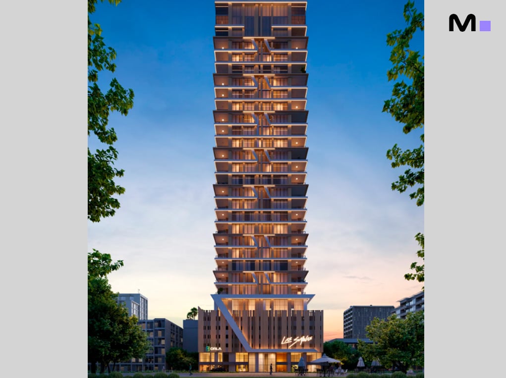 Edifício residencial Las Salinas, com arquitetura moderna e iluminação noturna.