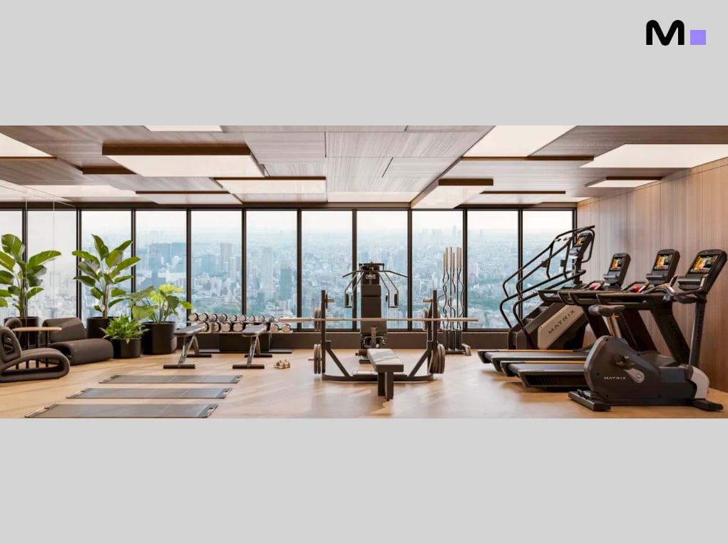 Academia moderna no Axion Towers com vista panorâmica da cidade e equipamentos Matrix.