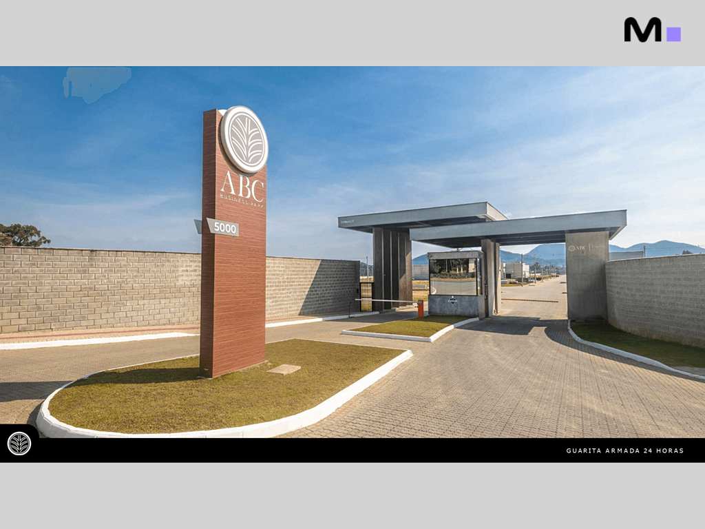 Entrada do ABC Business Park com guarita armada e paisagismo. "ABC" em destaque.