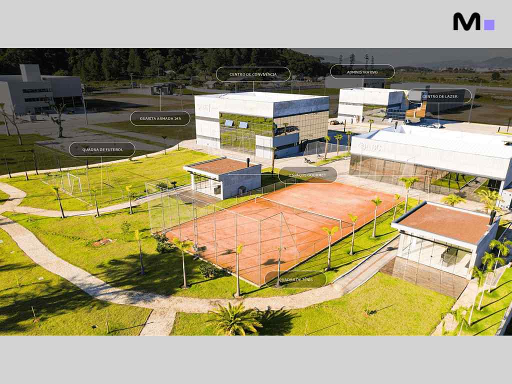 Vista aérea do ABC Business Park com quadras esportivas e prédios administrativos.