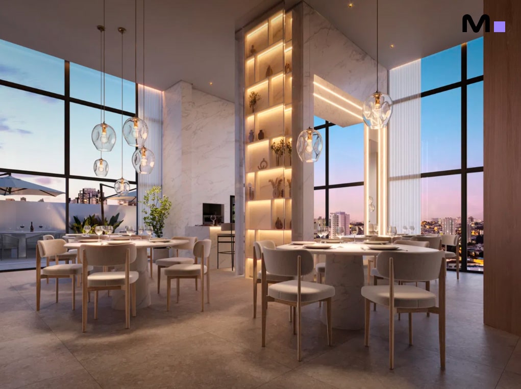 Interior elegante do Las Salinas Residence com mesas de jantar e vista panorâmica da cidade.