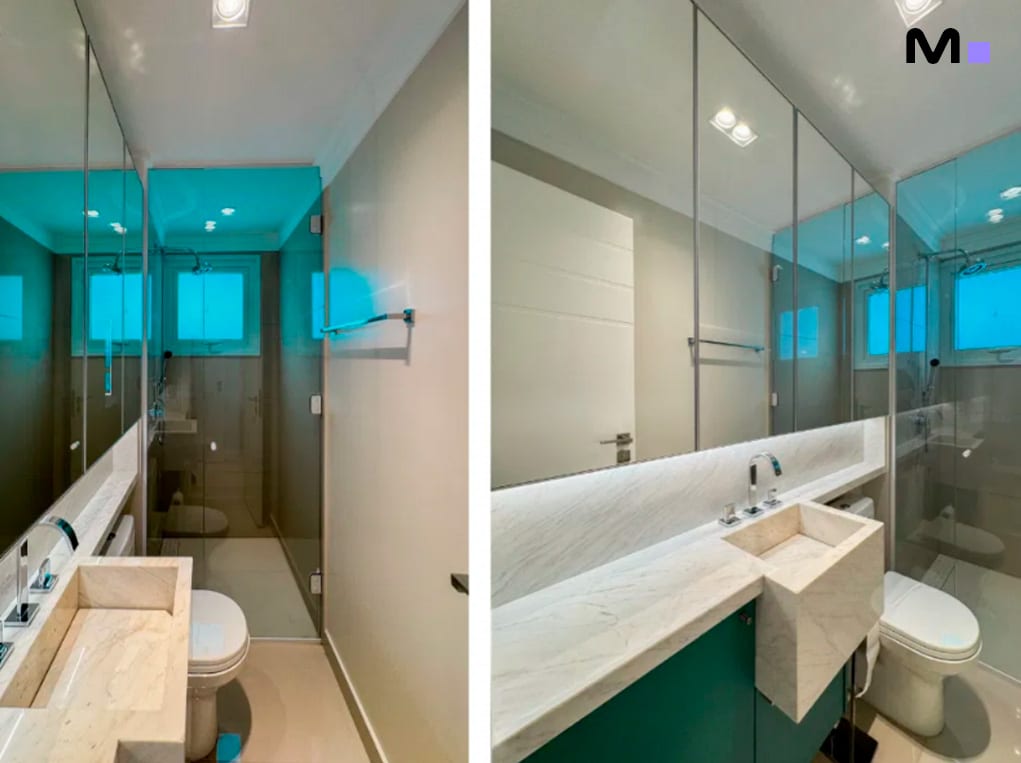 Banheiro moderno com pia de pedra e espelho amplo no Infinity Coast Residence.