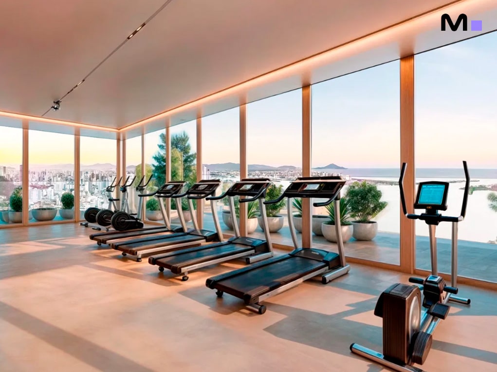 Academia moderna com vista panorâmica no Veredas Residence. Esteiras e equipamentos de ginástica.