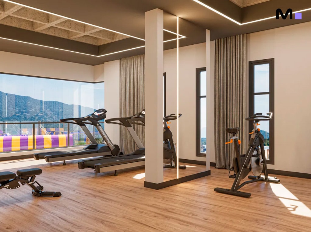 Academia moderna com esteiras e bicicletas ergométricas no Minuannon Residencial.