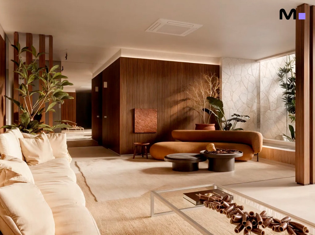 Sala de estar da Veredas Residence com sofá bege, painel de madeira e decoração minimalista.