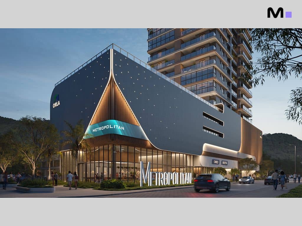 Fachada moderna do Metropolitan Modern Residences com pessoas e carros na rua.