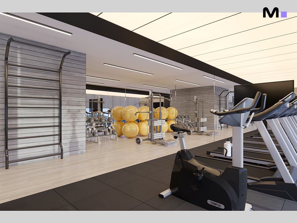 Academia moderna em Metropolitan Modern Residences com equipamentos e bolas de exercício.