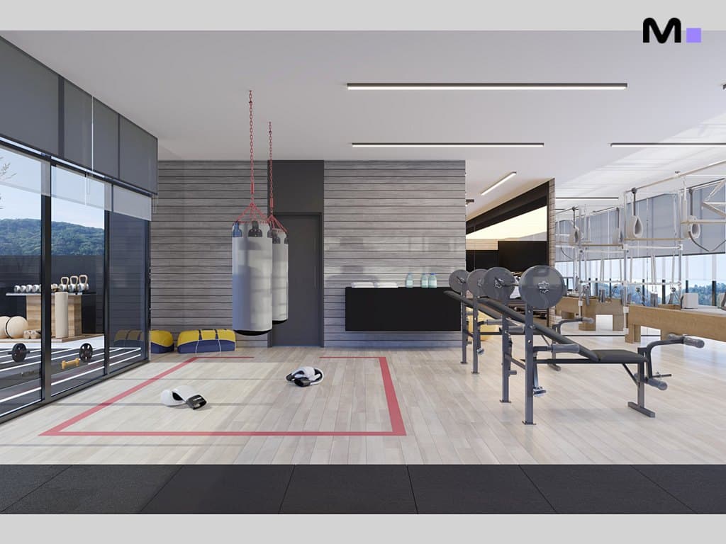 Academia moderna e iluminada com saco de pancada e equipamentos de musculação. Residências Metropolitan Modern.