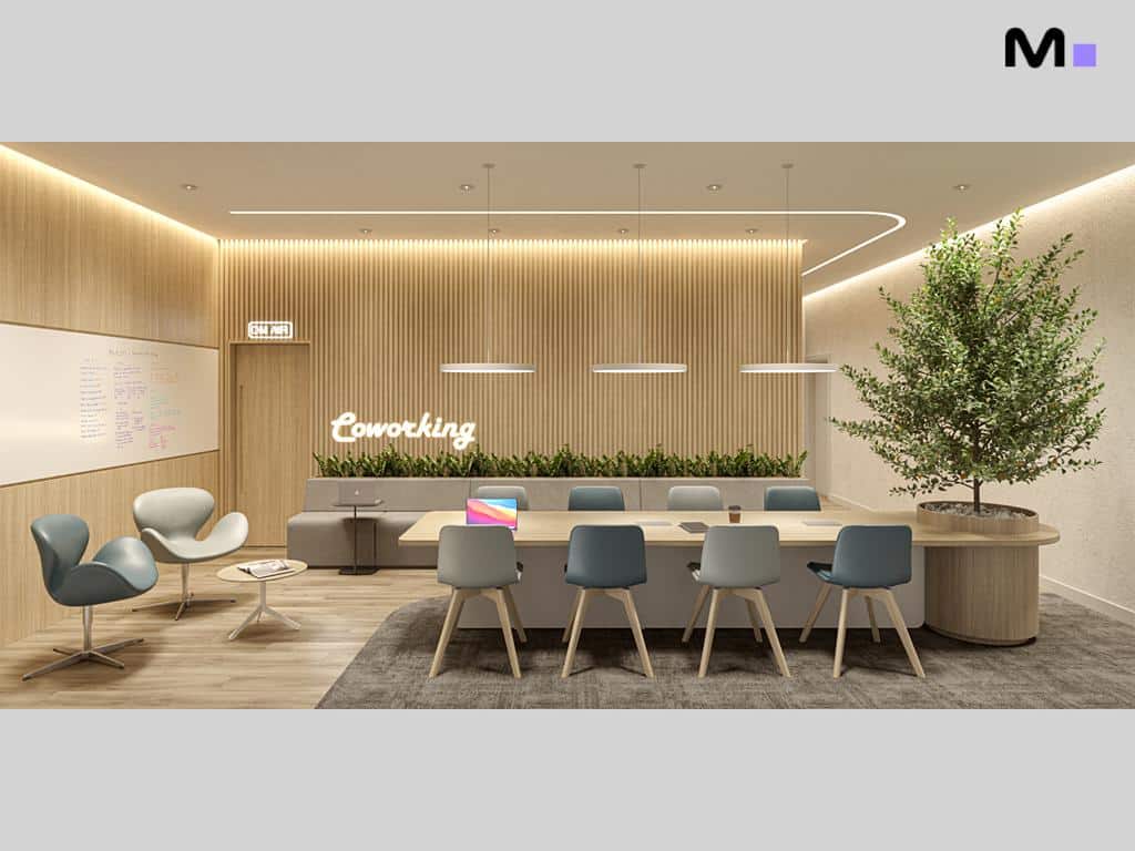 Espaço de coworking moderno com mesa de reunião e área de descanso. "Coworking" escrito na parede.