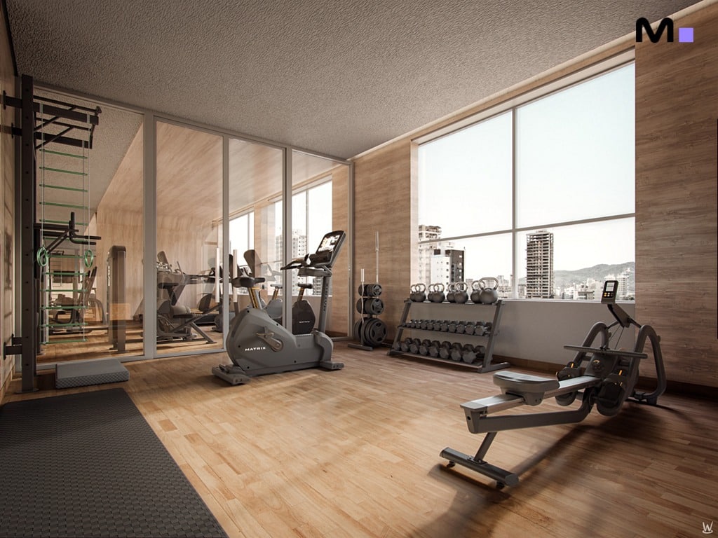 Academia moderna no Nilo Residence com equipamentos de ginástica e vista da cidade.