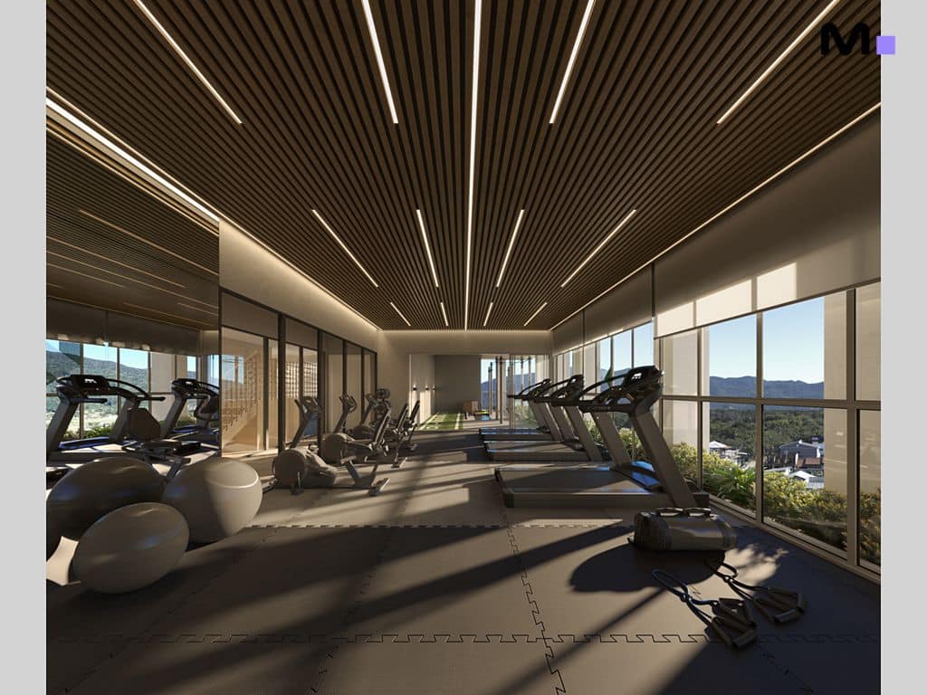 Academia moderna e bem iluminada no Hyde Residence com esteiras e equipamentos de ginástica.