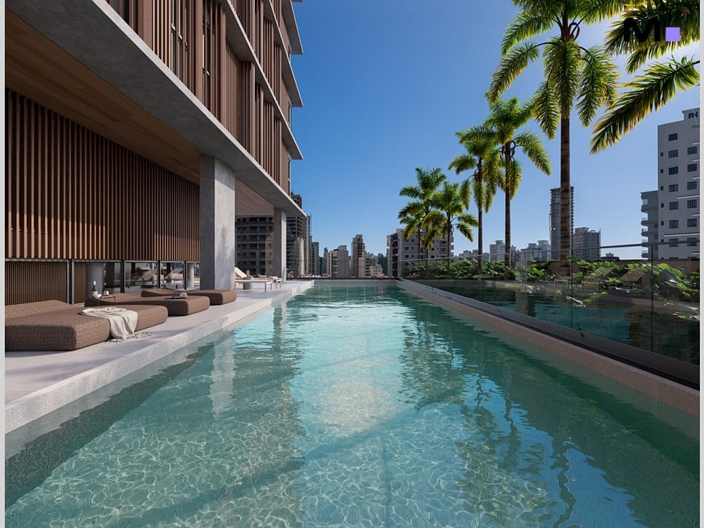 Piscina infinita no Vibra Phacz Home com vista para a cidade e palmeiras.