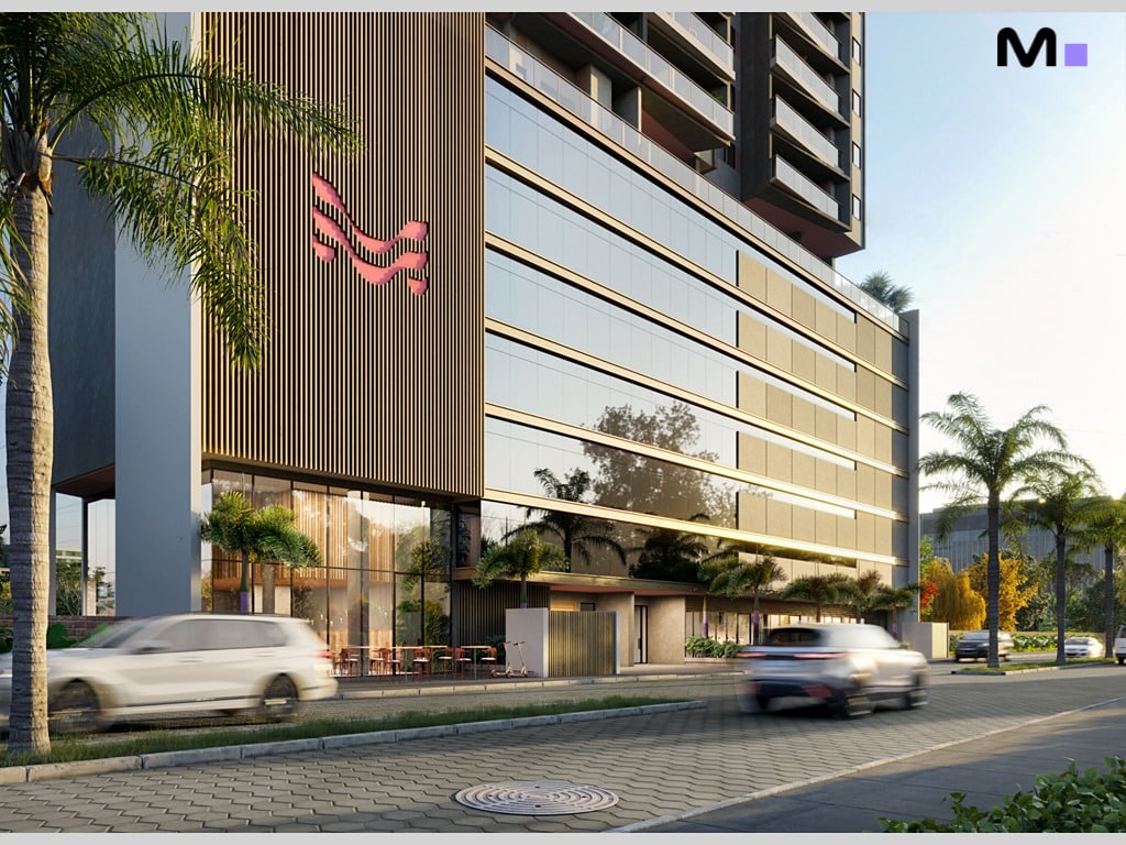 Edifício moderno Quest Residence com fachada envidraçada e carros na rua.