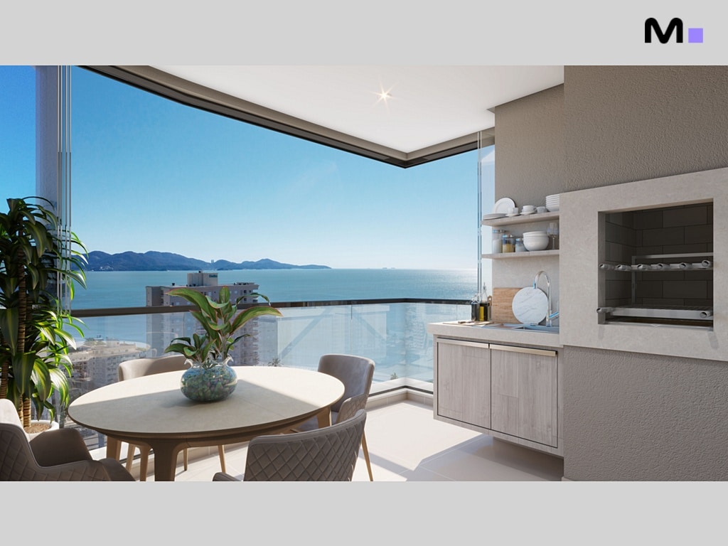 Varanda gourmet do Mont Blanc Residence com churrasqueira e vista para o mar.