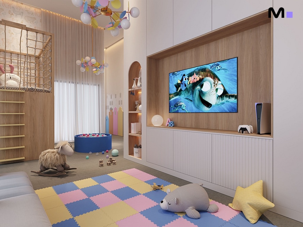 Sala de jogos infantil colorida com TV exibindo "Procurando Nemo". Tapete de espuma e área de lazer aconchegante.