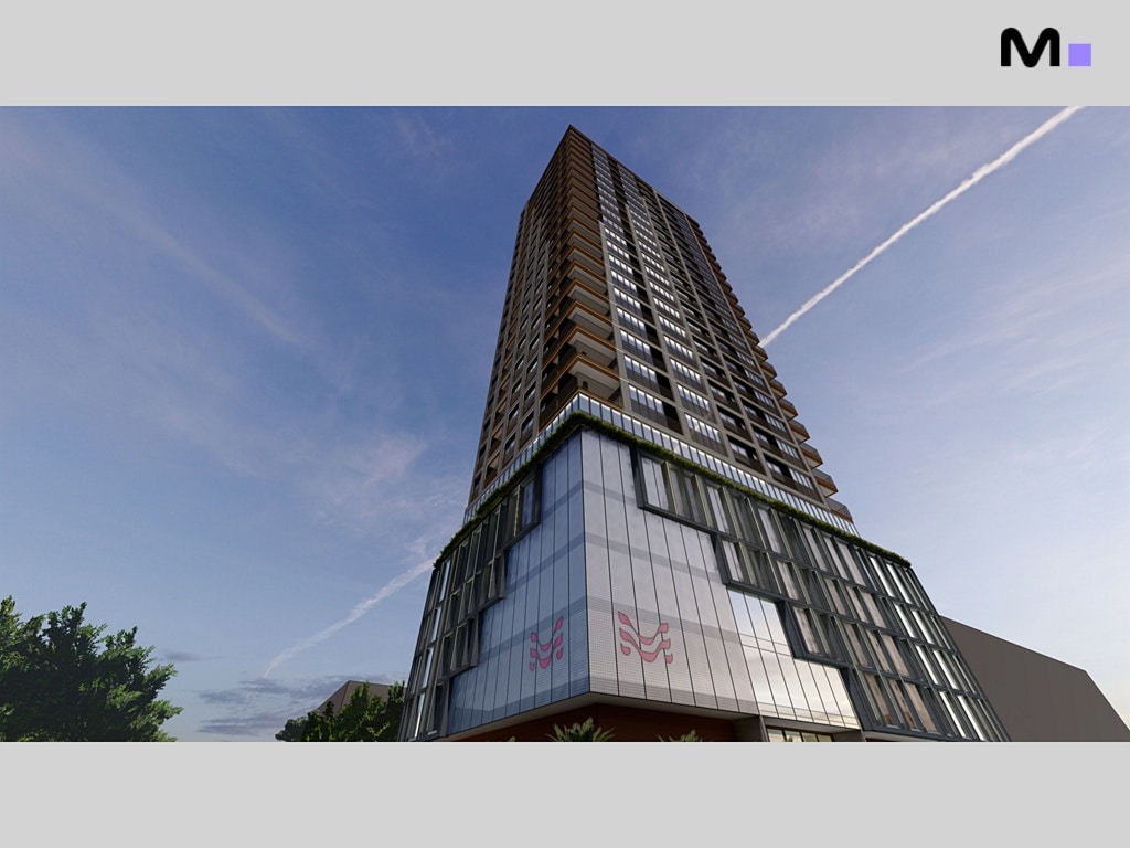 Edifício alto Vega Apartments Residence com fachada moderna e céu azul.