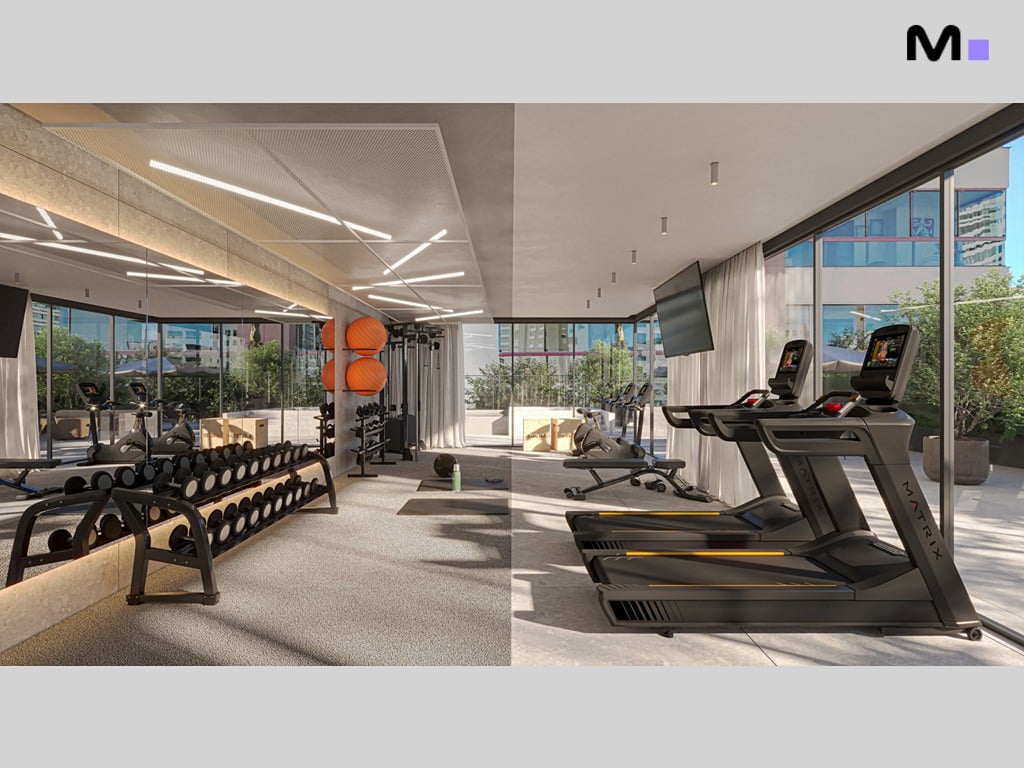 Academia moderna nos Apartamentos Vega Residence com esteiras, halteres e espelhos.