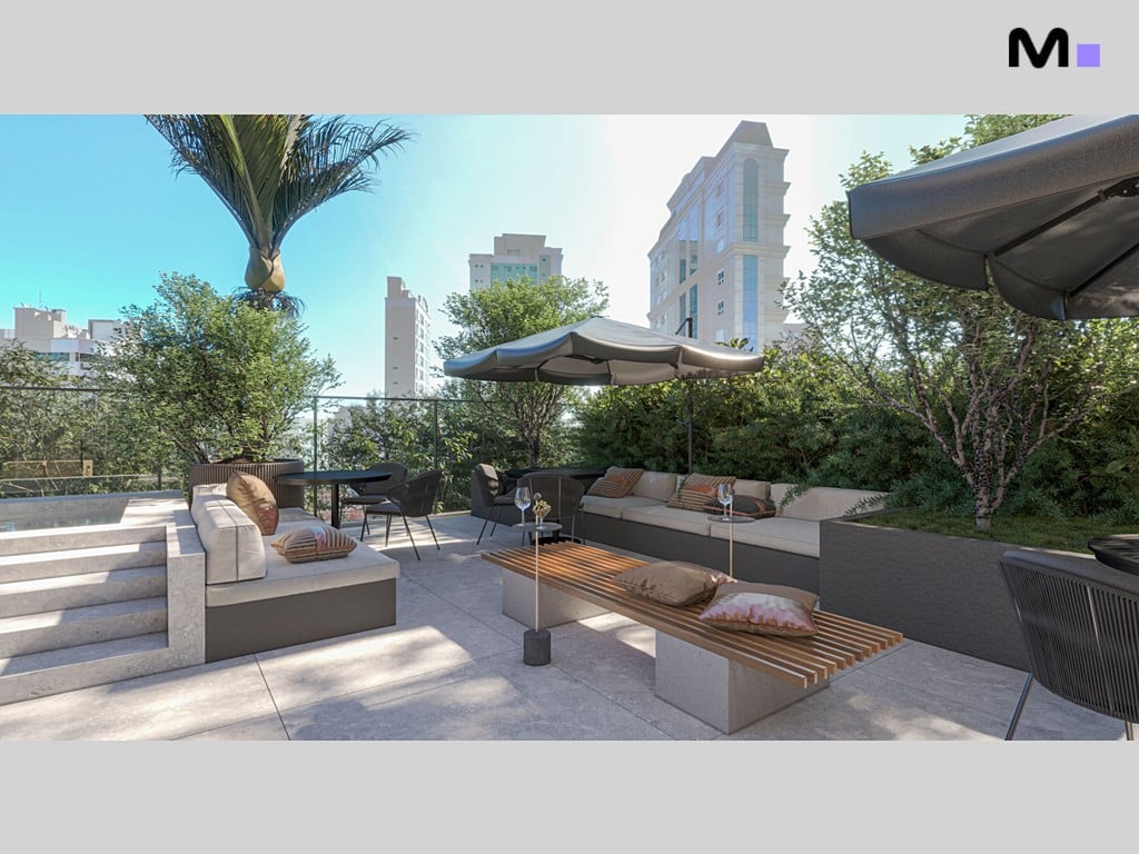 Área de lazer externa do Vega Apartments Residence com sofás, cadeiras e guarda-sóis.