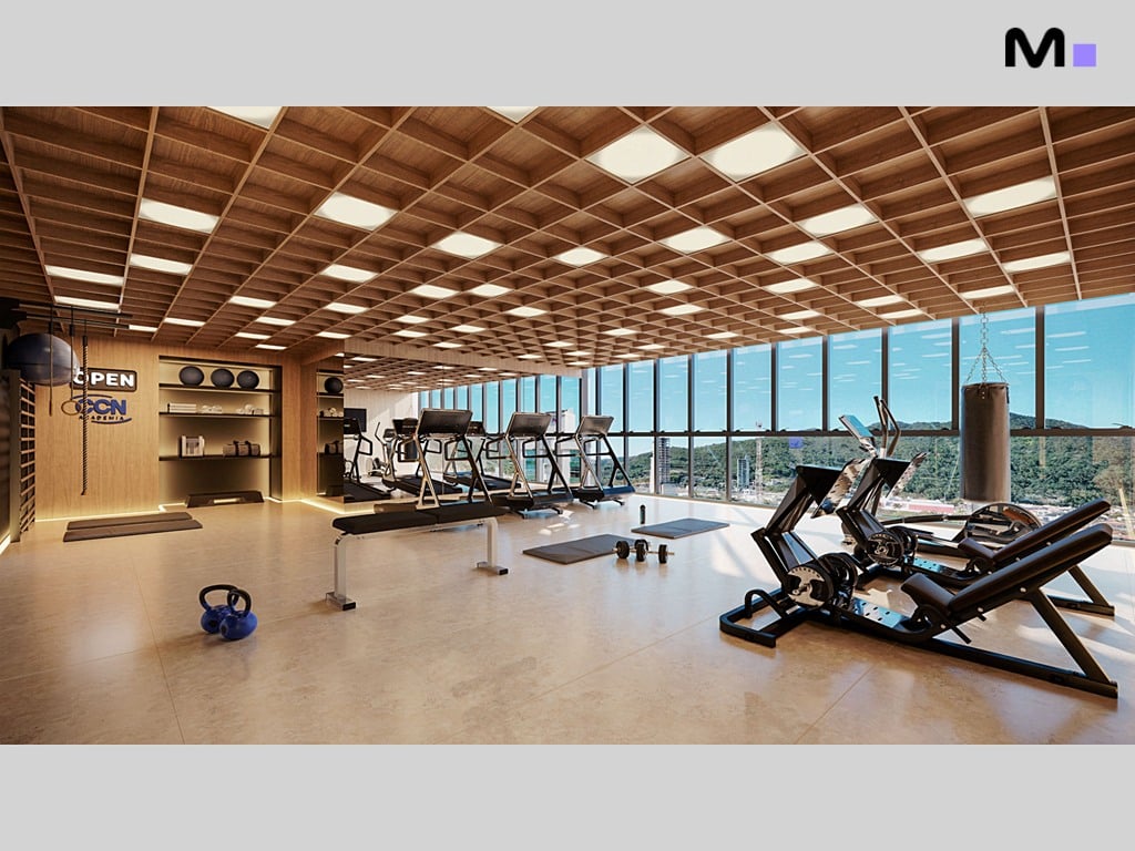 Academia moderna e bem iluminada no Hera Home Residence, com equipamentos e vista panorâmica.