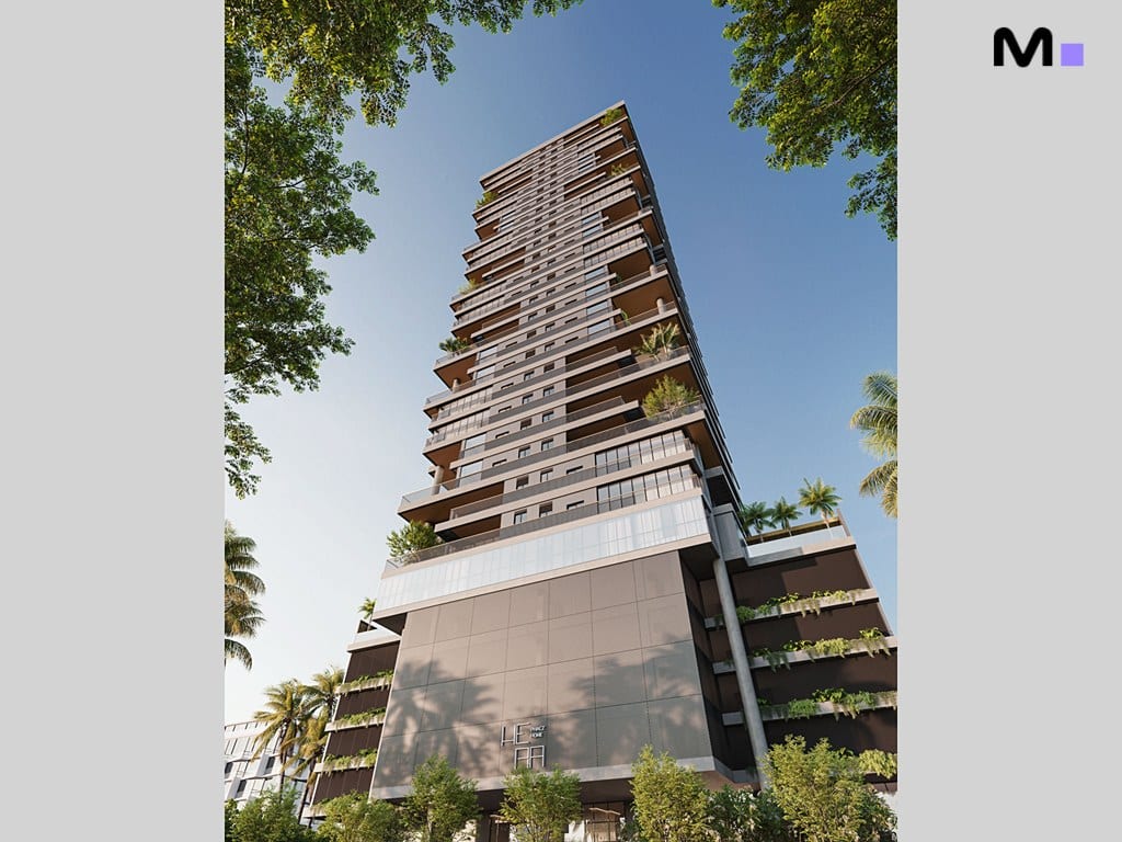 Residência Hera Home: Vista externa do edifício alto com varandas e vegetação, sob céu azul.