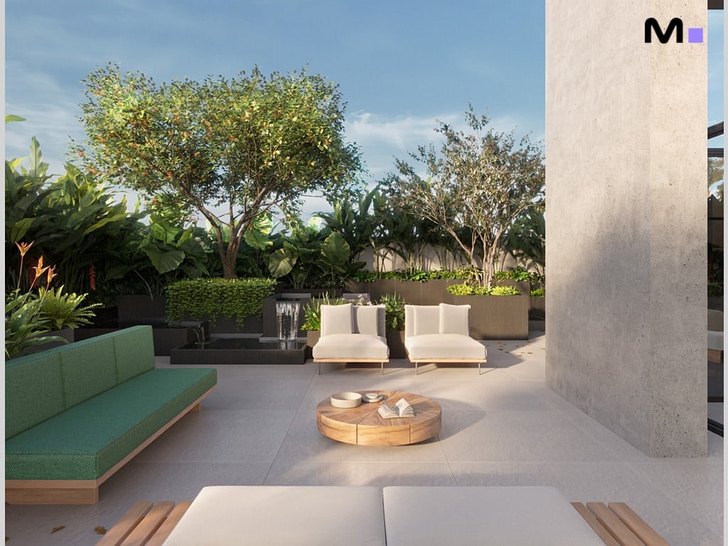 Área externa relaxante com sofás, cadeiras e vegetação exuberante. Vibra Phacz Home.