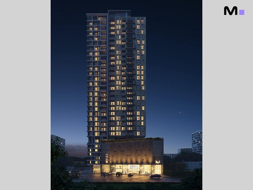 Hyde Residence: Vista noturna do edifício alto e moderno, com luzes acesas.