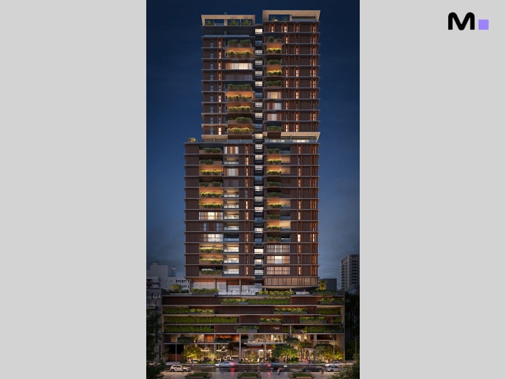 Edifício residencial Vibra Phacz Home com varandas verdes e iluminação noturna.