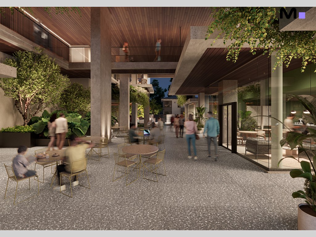 Área externa do Vibra Phacz Home com pessoas, mesas e paisagismo moderno.