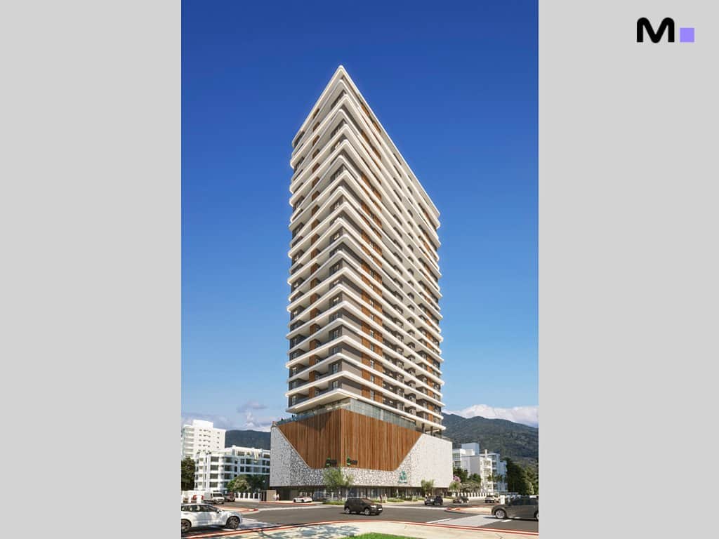 Edifício moderno Platja D'en Bossa Residence com design triangular e varandas, sob céu azul.