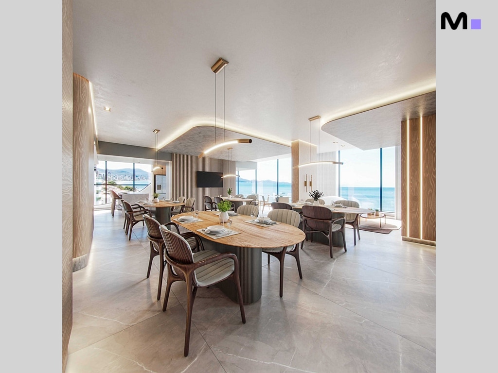 Interior moderno do Hudson Park Residence com vista para o mar e mesas de jantar elegantes.