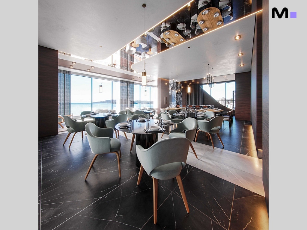 Interior elegante do Hudson Park Residence com mesas redondas, cadeiras modernas e vista para o mar.