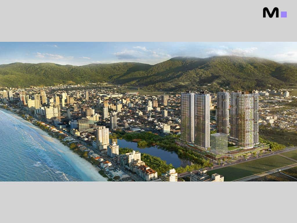 Vista aérea do Lagom Perequê Residence, com prédios modernos e paisagem natural exuberante.