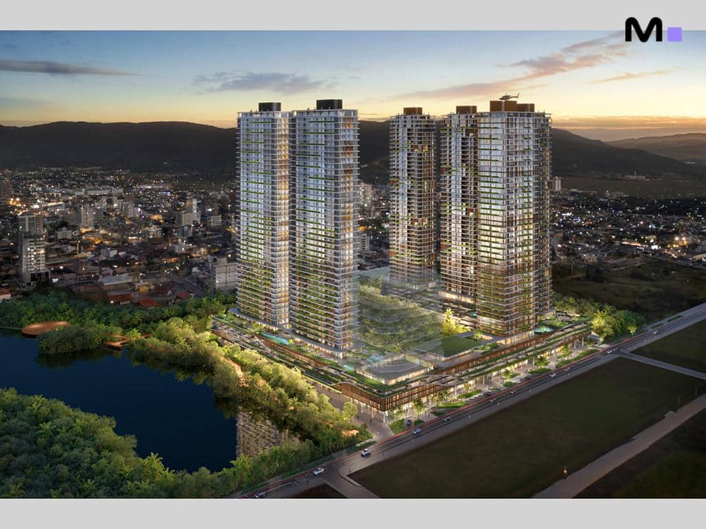 Residências Lagom Perequê: vista aérea das torres modernas ao lado de lagoa e cidade.