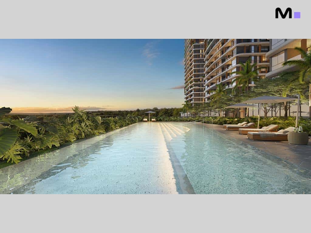 Piscina do Lagom Perequê Residence com vista para o horizonte e espreguiçadeiras.