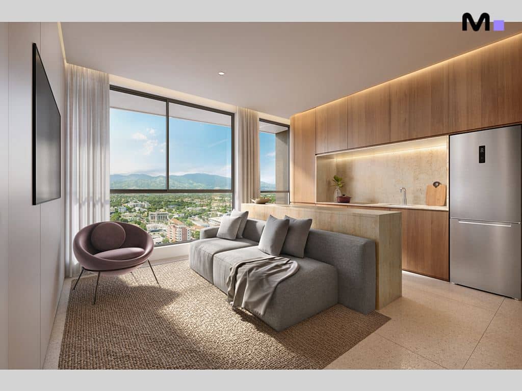 Sala de estar moderna com sofá cinza e vista ampla, parte do Lagom Perequê Residence.