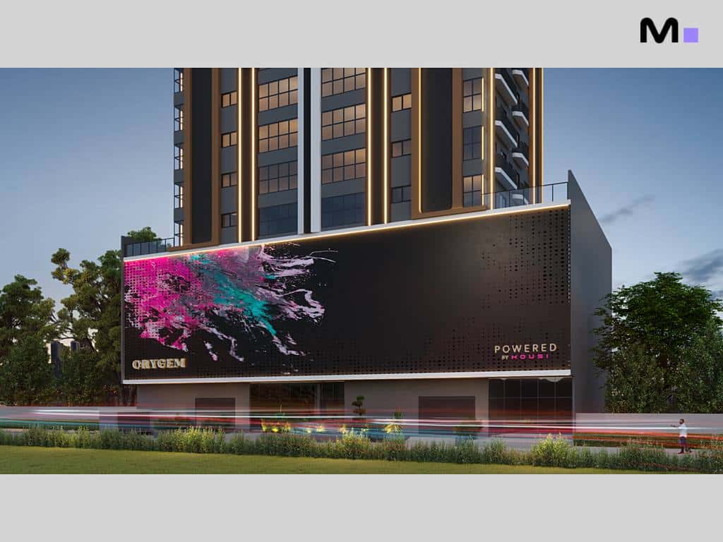 Prédio Orygem Powered by Housi com arte colorida na fachada. Arquitetura moderna.
