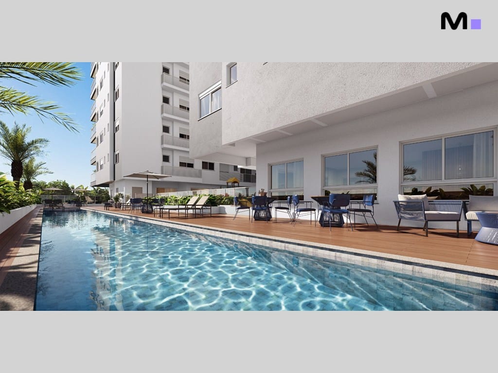 Piscina do Seven Residence com área de lazer e cadeiras confortáveis.