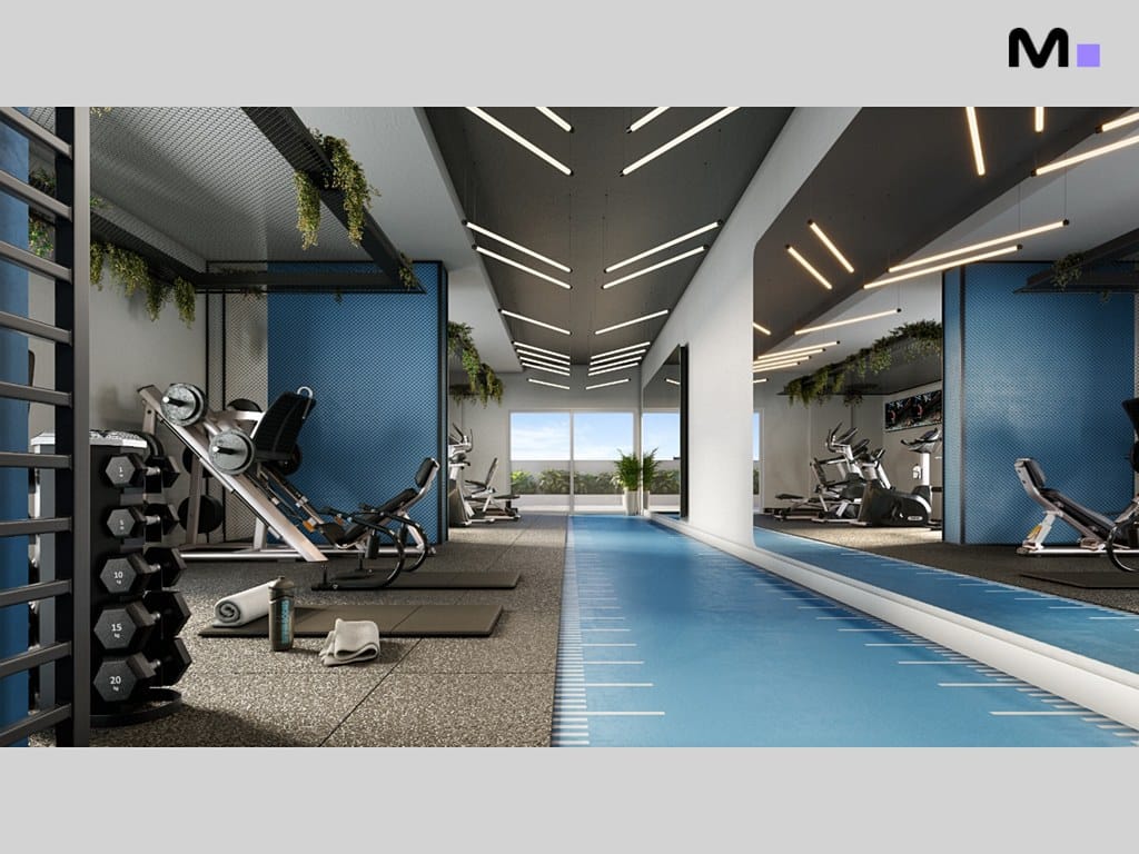 Academia moderna no Seven Residence com equipamentos de ginástica e pista azul.